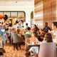 Mickey Mouse at Disney World restaurant greeting families